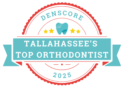 Badge reading "Denscore: Tallahassee's Top Orthodontist 2025" with dental emblem and star icons.