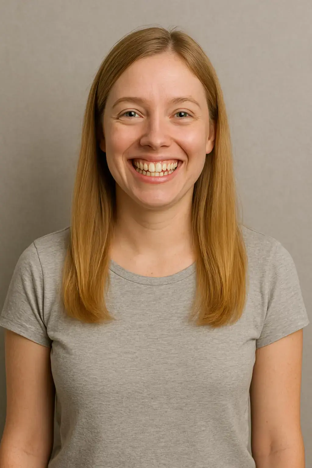 Smiling woman with light brown hair and gray shirt showing crowded teeth consider Invisalign vs Braces for dental treatment at Redemption Orthodontics in Tallahassee, FL. Smiling woman with light brown hair and gray shirt showing crowded teeth consider Invisalign vs Braces for dental treatment at Redemption Orthodontics in Tallahassee, FL.