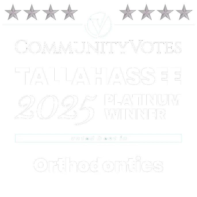Recognized as the 2025 Platinum Winner for Orthodontics by CommunityVotes Tallahassee Platinum Winner badge for Orthodontics, awarded to Redemption Orthodontics in Tallahassee, FL, with stars along the top.